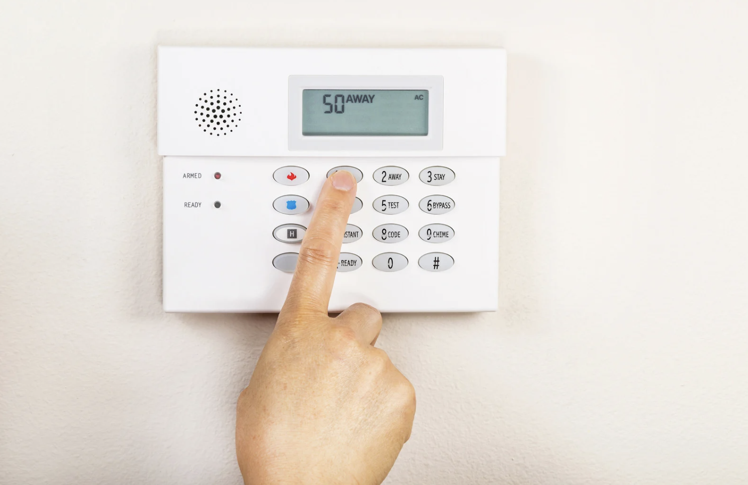 white wall mounted alarm system