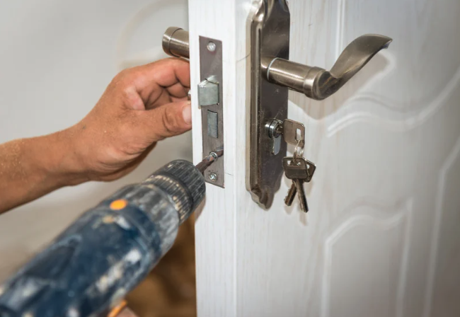 man drilling in a new lock