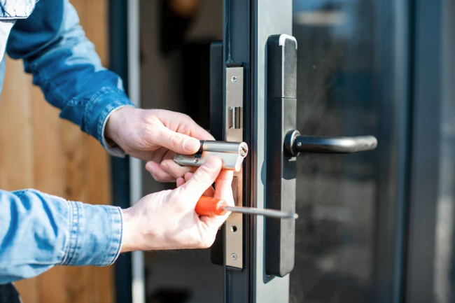 locksmith putting in a new lock